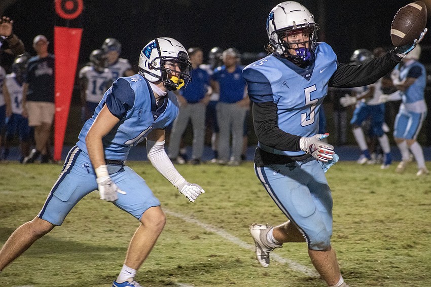 ODA senior Chase Taraska shows off the ball after coming up with an interception against LPCA.