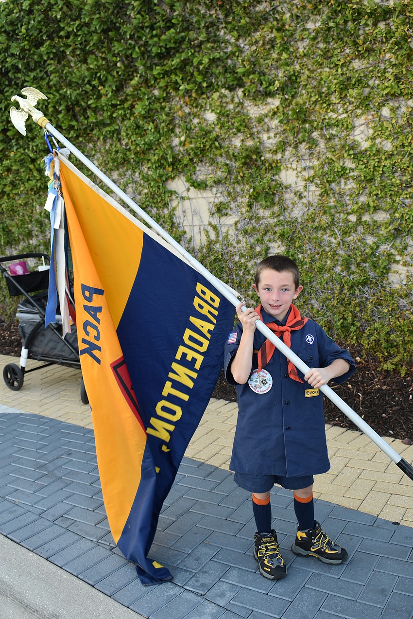 Jacob Hendrickson of Pack 126 (Peace Presbyterian Church) had a big chore in front of him. He had to carry his pack's flag.