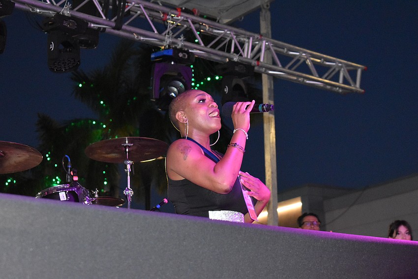 Parrish's Shantel Norman sings the National 
Anthem to get the festivities started. She also was a judge for the parade entries.