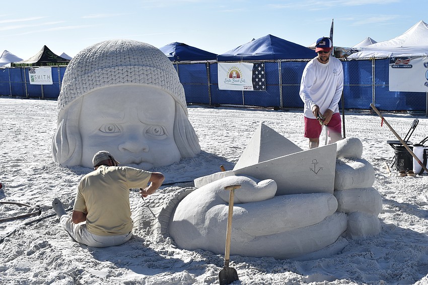 Vaclovas Petkus and Andrius Petkus of Lithuania work on 