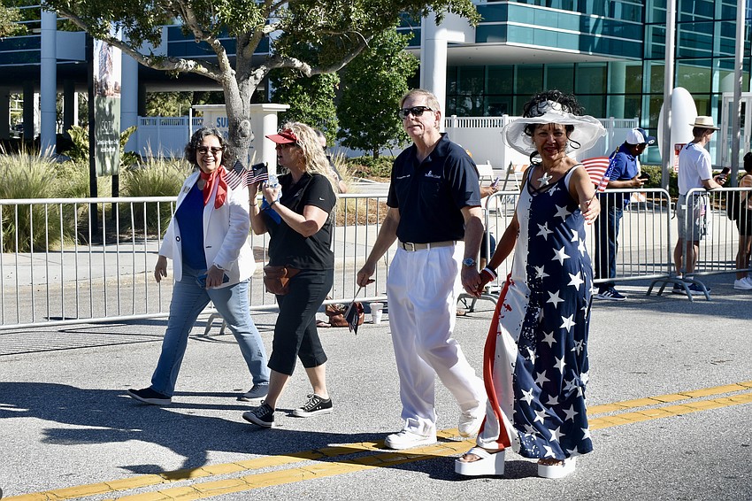 City commissioners Debbie Trice and Jen Ahearn-Koch, and County Commissioner Mark Smith and his wife Esther Smith, make their way down Main Street.