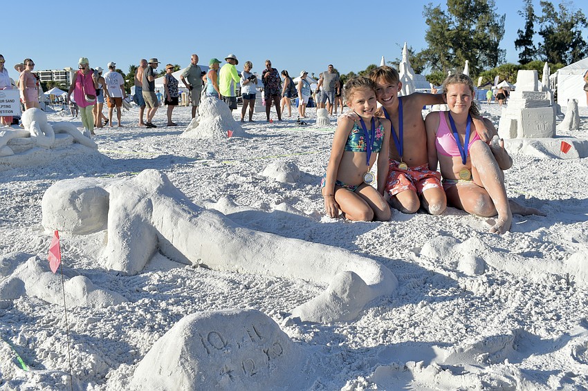 Charlotte Pote, 10, Michael Pote, 12, and Addison Pote won first place in the Turtle Bale category in the amateur sculpting competition.