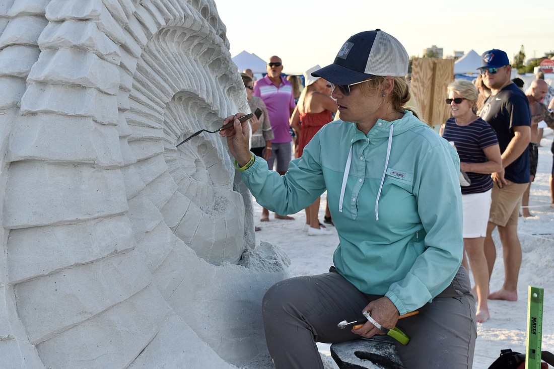 Amanda Bolduc from Maine, USA, works on her sculpture.