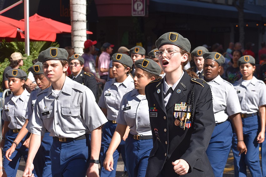 Members of the Sarasota High School JROTC Bull Dog Battalion make their way down the parade route.