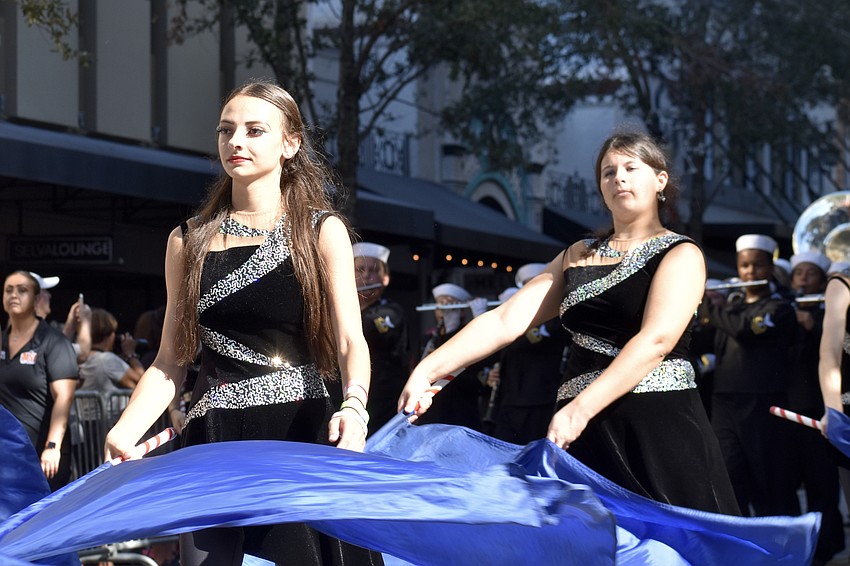 Members of Sarasota Mighty Sailor Band from Sarasota High School offer a performance.