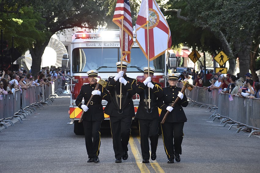 Members of the Sarasota County Fire Department make their way down the parade route.