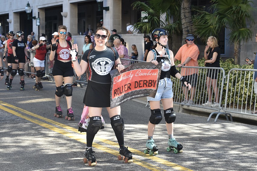 Members of the Bradenton Bombers Roller Derby skate down the parade route.