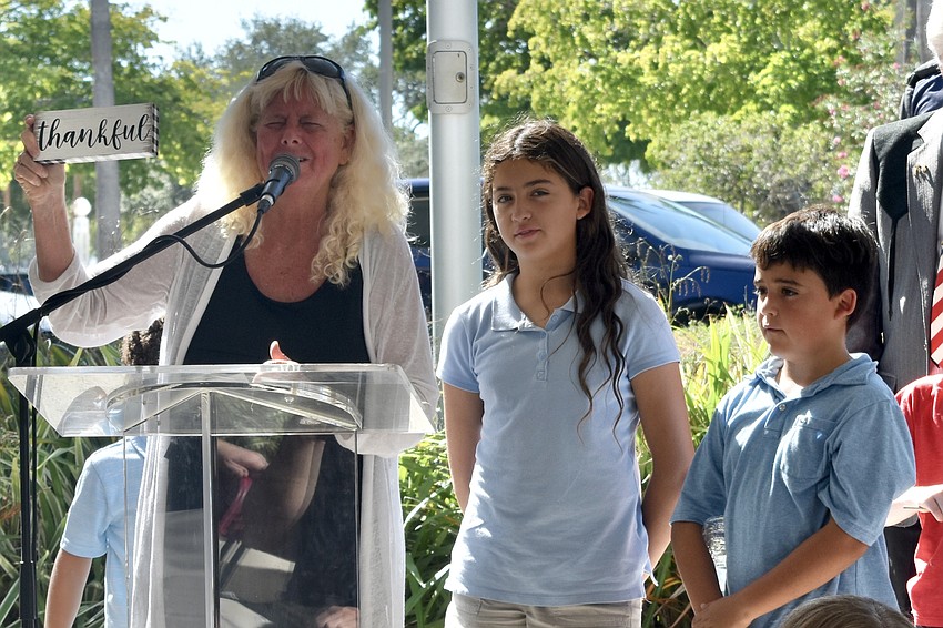 Jan Solomon invited children in the group onto the stage, including her two grandchildren Ivey Coletti, 10, and Elijah Coletti, 9.