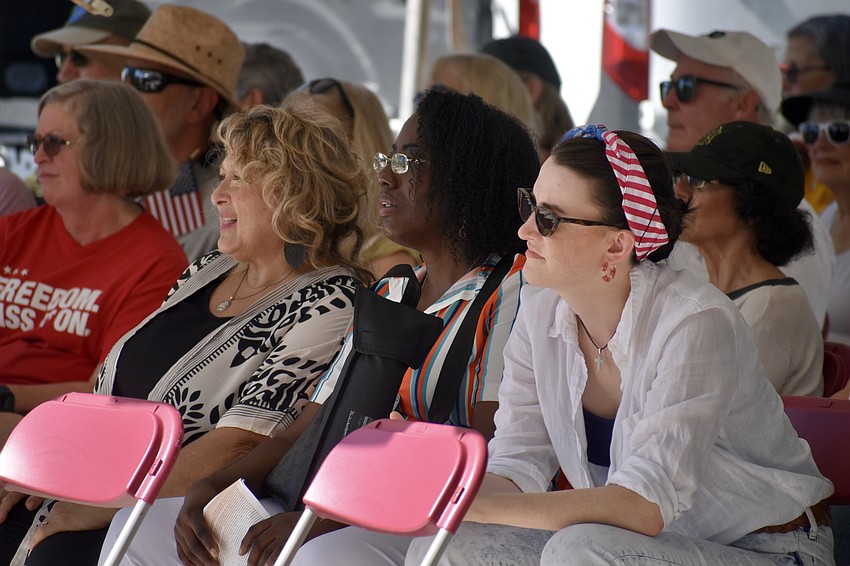 Cherel Rivera, Yolanda Russell and Cheryse Burns watch the ceremony.