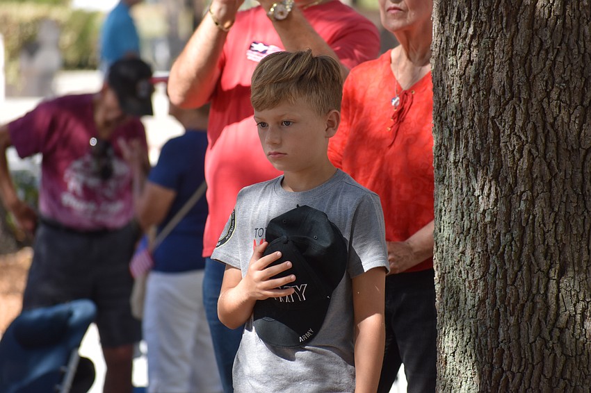 Liam Jerez, 9, participates in the ceremony. His father, Julian Jerez, is a veteran. 