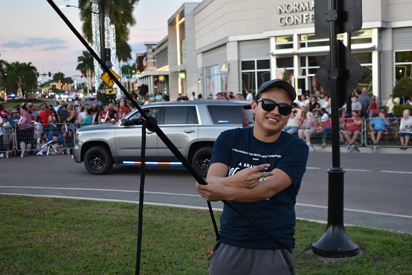 Isaib Trujillo had one of the toughest jobs at the Santa's Grand Arrival Parade. He had to hold a support that held the high wire tight for Nik Wallenda.