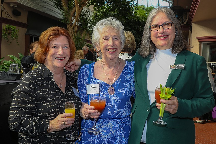 Brenda Griffiths and Eileen Hampshire stop for a photo with board member Dr. Deborah Hamm.