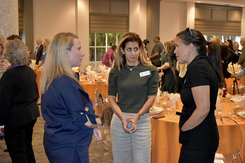 Lauren Kurnov of Ringling College of Art & Design, and Rachel Saltzberg and Brenna Wilhm of Hershorin Schiff Community Day School talk with one another.