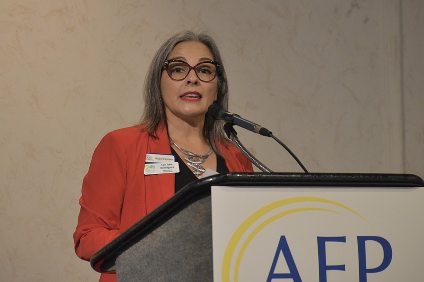 AFP Board member Lee Ann Rodriguez offers a speech.