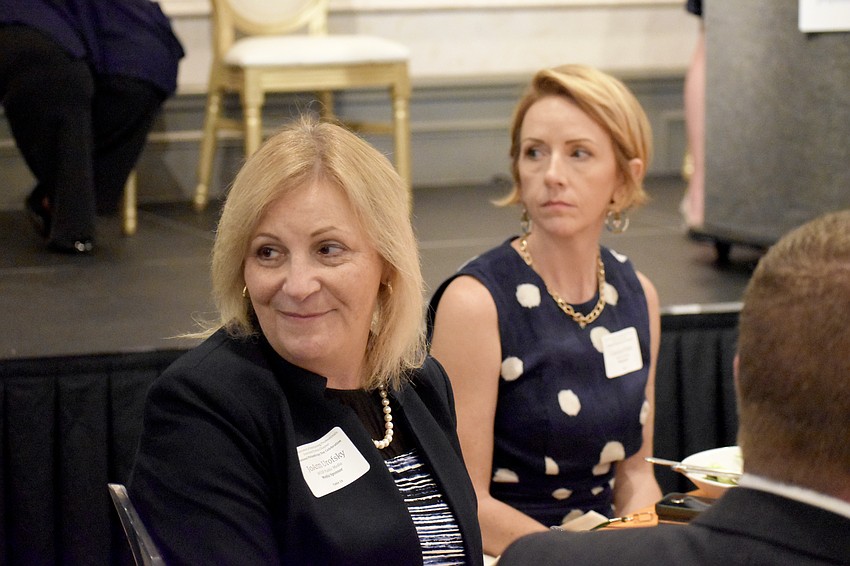 JoAnn Urofsky and Candace Wiant of of WUSF Public Media watch as honorees receive recognition.
