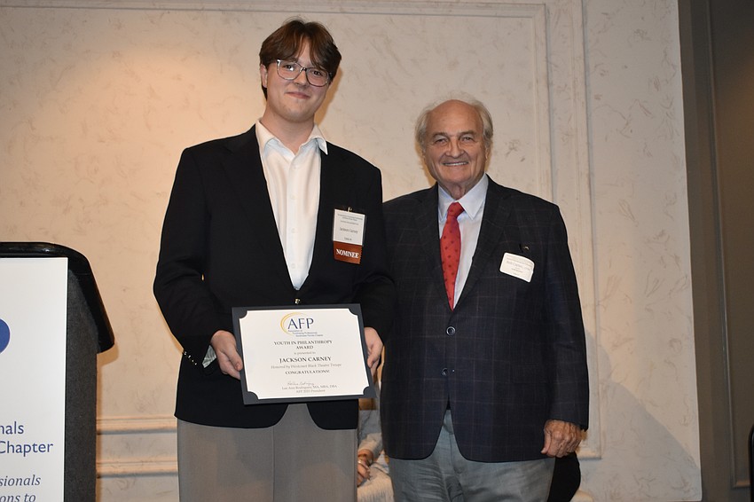 Youth honoree Jackson Carney, a Booker High School student and volunteer at Venice Theatre, with Bob Carter of Carter Advancing Philanthropy Worldwide, the event's platinum sponsor.