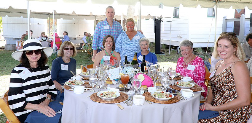 Nancy Markle, Caryl Kaplan, Jennifer Johnston, Joan Matthews, Judy Miller and Kirstin Fulkerson. Standing are  Phillip Lanham and his wife, Tami.