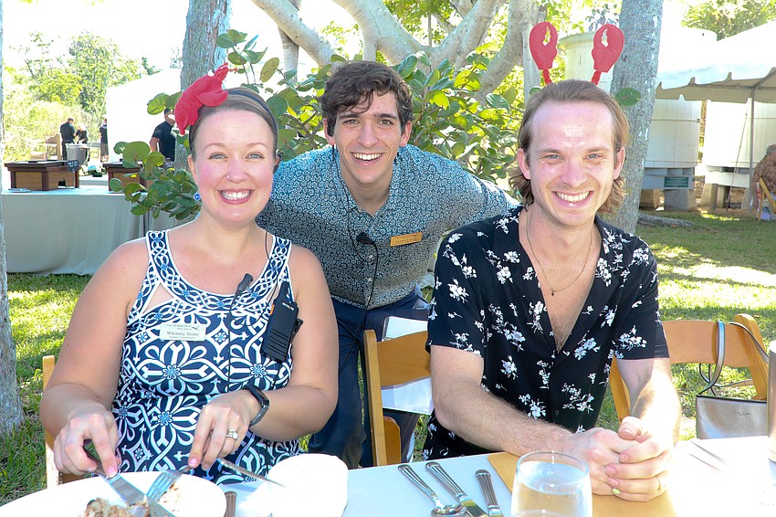 Grants Coordinator Whitney Stone, Executive Assistant/Residency Coordinator Andres Larrea, and volunteer Chase Alford have smiles on their faces as they take a quick break and enjoy lunch.