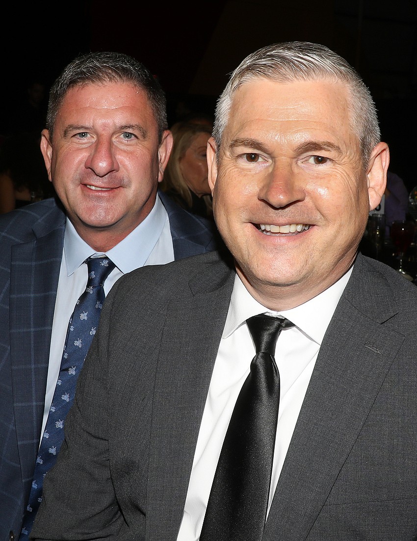 Forrest Balderson enjoys dinner with Ron Turner.