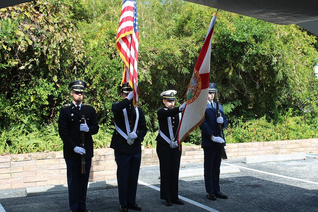 The Embry Riddle Aeronautical University Joint Color Guard presents the flag for the pledge of allegiance. Photo by Alexis Miller