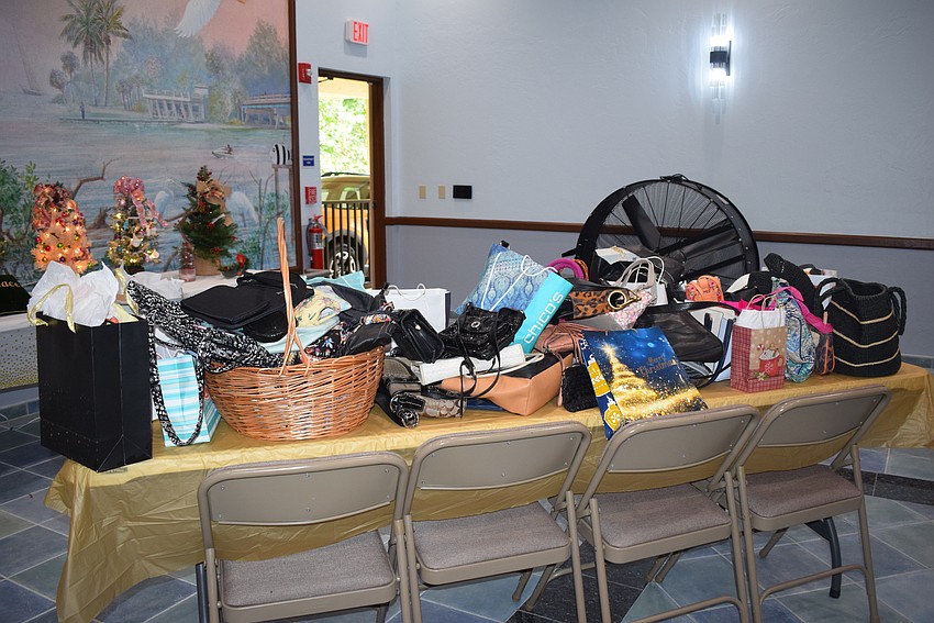 The Star of the Sea Women's Guild donated gently used purses with goods inside to donate to Second Heart Homes.