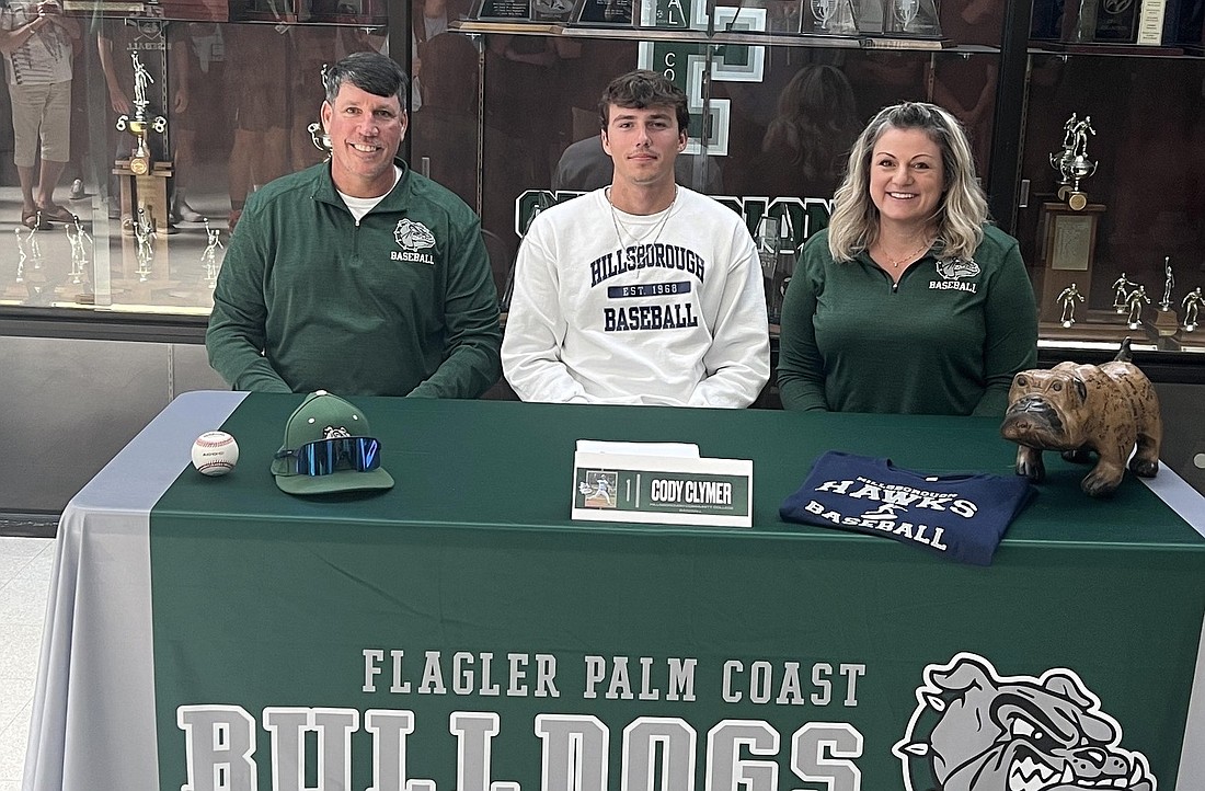FPC baseball player Cody Clymer with his parents at the Bulldogs' signing ceremony. Courtesy photo