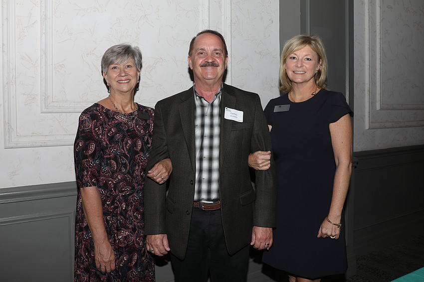 Tora Buttaro, volunteer art teacher Carlos Guebels and Director of Finance Kim LeClair