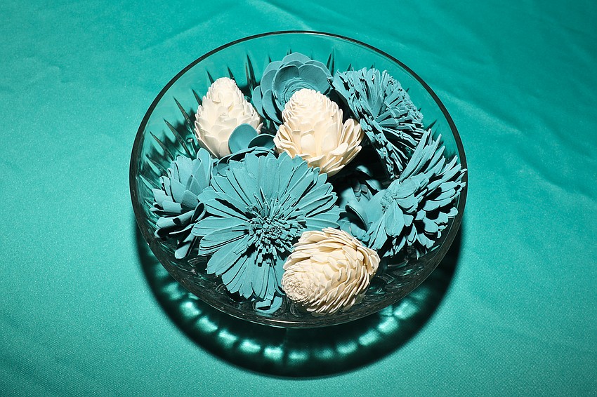 The table centerpieces were made from flowers from the Pines Fabulous Finds Thrift Stores.