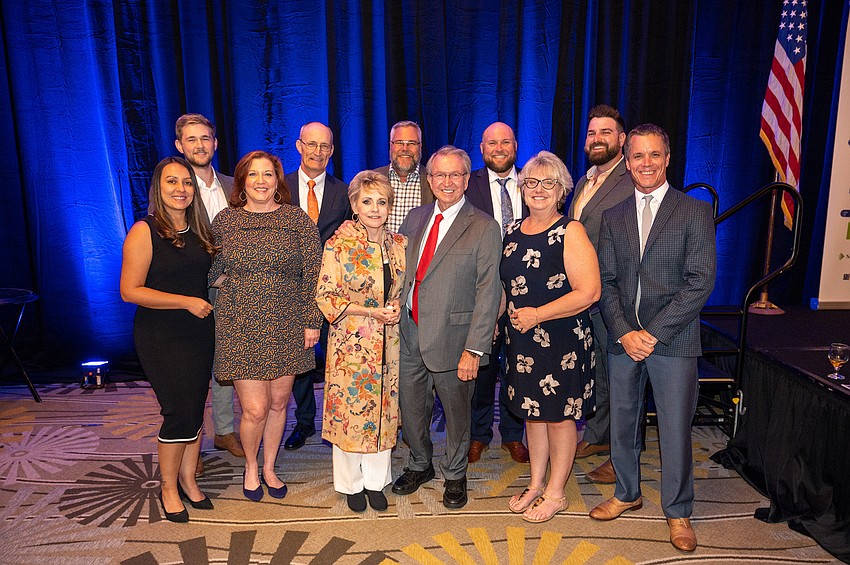 Jon Swift,  Argus 21st Annual Lifetime Achievement Award winner with his family