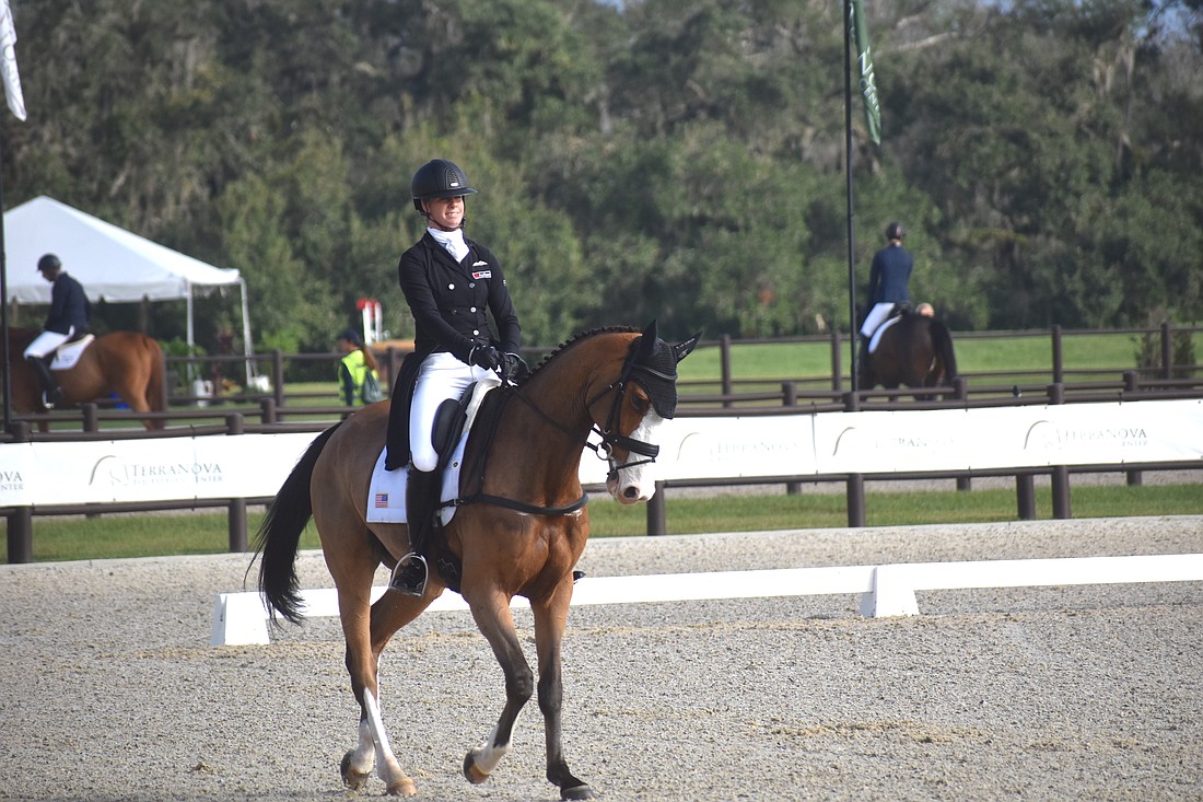 Caroline Pamukcu of Riegelsville, Pennsylvania, competes in the dressage class of The Event at TerraNova in Myakka on Friday. The event continues Saturday and Sunday and is free to the public.
