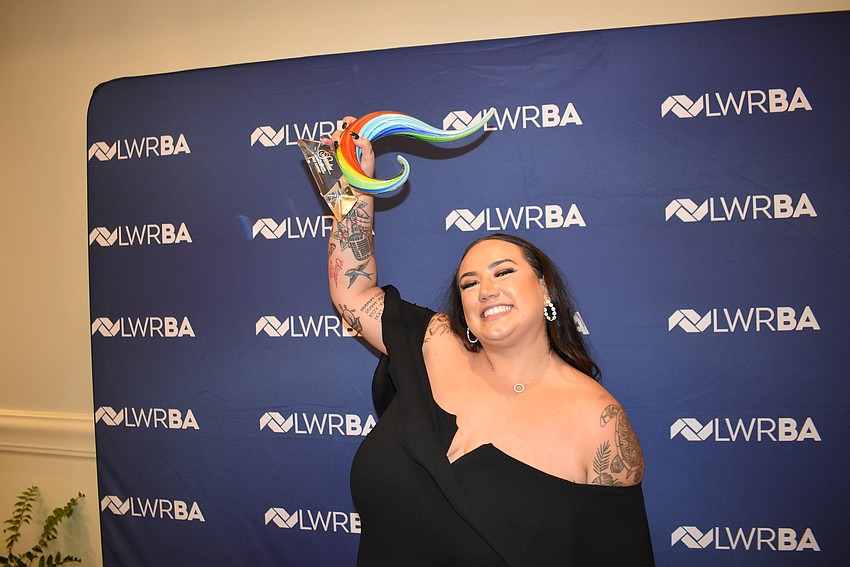 Zoe Kasper of Bekins Moving Solutions celebrates with the Networking Queen award.