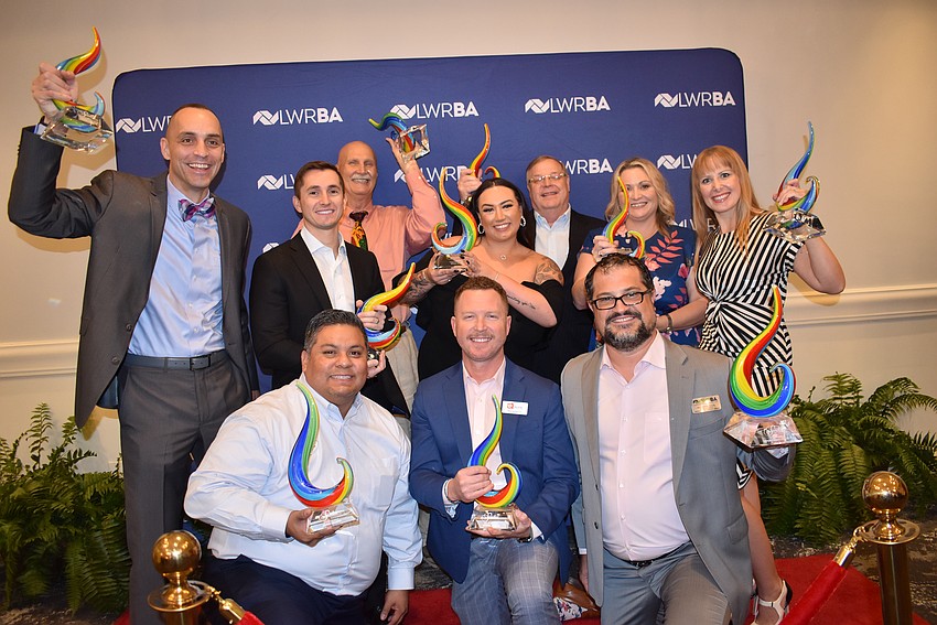 The Lakewood Ranch Business Alliance's Sandies winners on Friday at the Grove are (back row) Kevin Cooper, Tieler Gittleman, Dennis Butt, Zoe Kasper, Kent Jimison, AnneMarie Graff and Skyler Betts; and (front row) Jorge Augero, Wayne Parrish and Keith Pandeloglou.