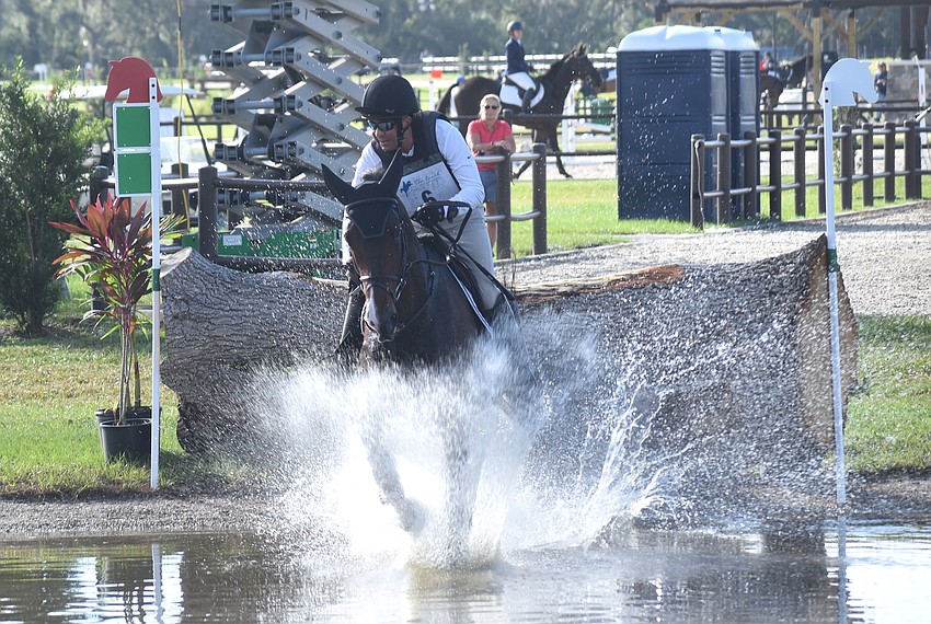 Michigan's Robin Walker makes a big splash aboard Cappog Ferro Royale during the cross country portion of The Event at TerraNova.