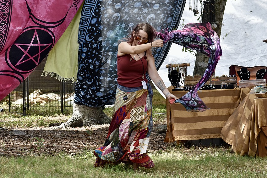 Ashley Ambrose of Kizmet - Gypsy Market dances to the music.