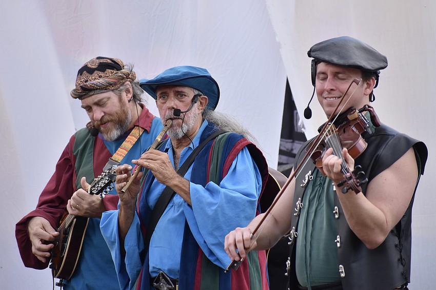 Members of The Jackdaws offer a performance.