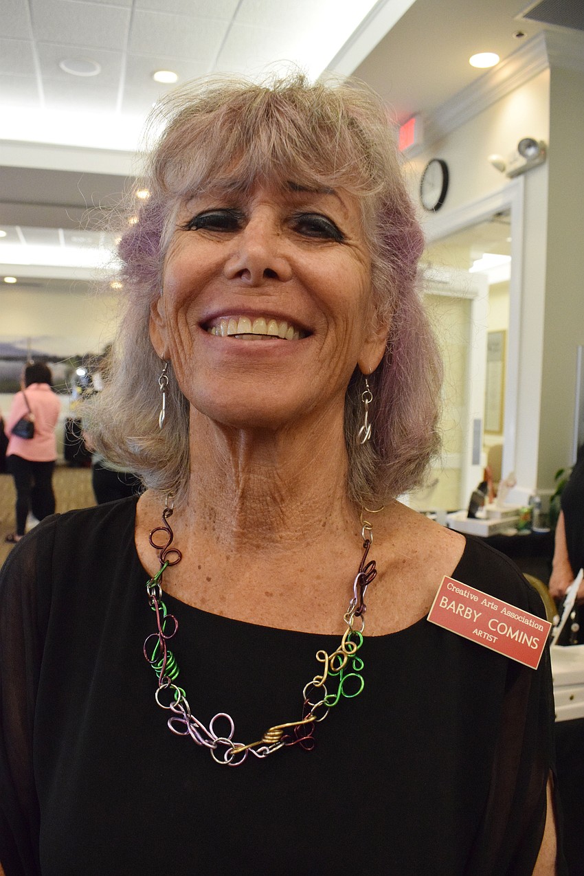 Palmer Ranch's Barby Comins shows off her favorite piece she's made.