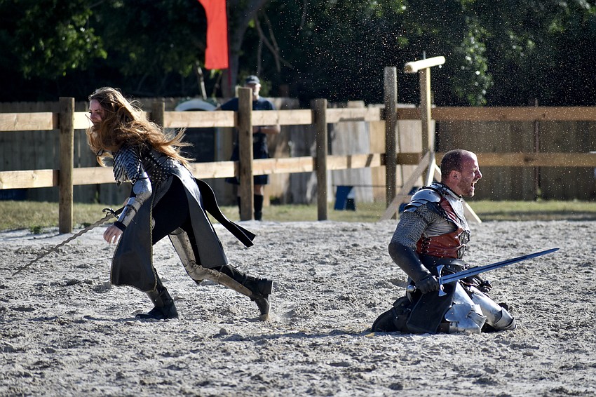 Sir Lilith (Erin Eisenmann) delivers a defeating blow to Sir Michael (Michael Murphy).