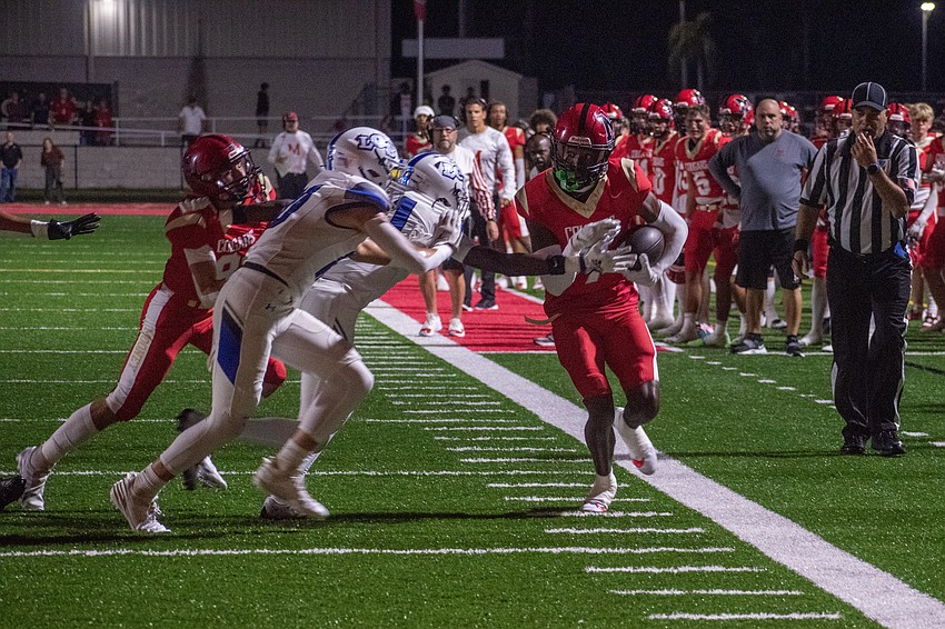Cardinal Mooney receiver Zy'marion Lang sprints up the sideline.