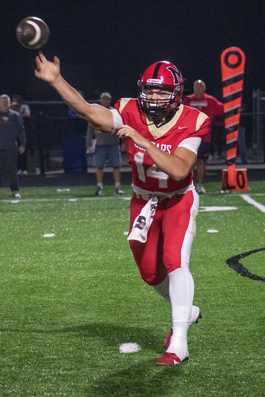 Cardinal Mooney sophomore Devin Mignery throws a pass to his left. Mignery threw two touchdowns against Lakeland Christian.