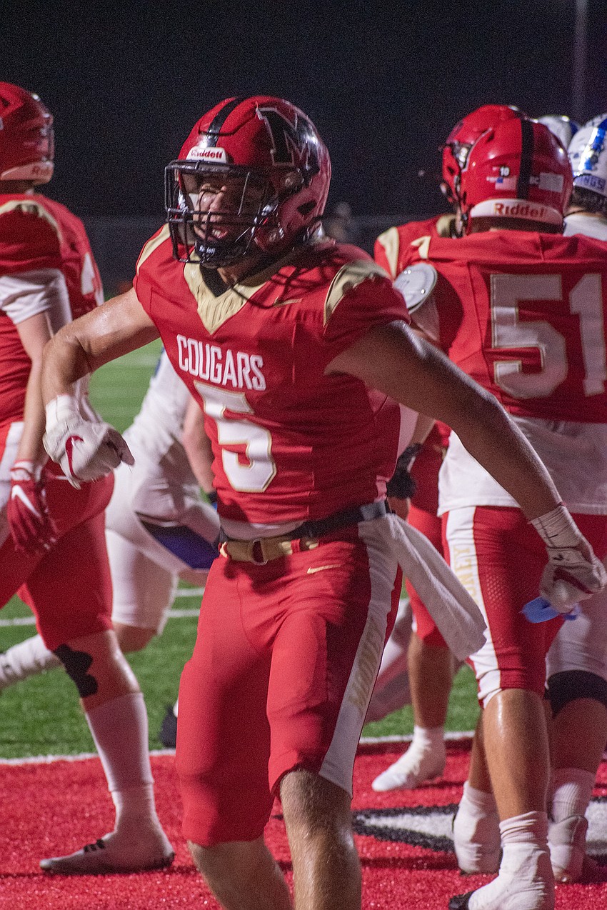 Cardinal Mooney senior George Leibold celebrates after a Mooney touchdown.