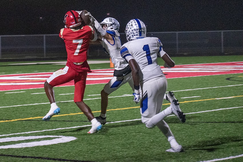 Cardinal Mooney senior receiver Zy'marion Lang uses his helmet to make a catch against Lakeland Christian. The play would result in a touchdown.