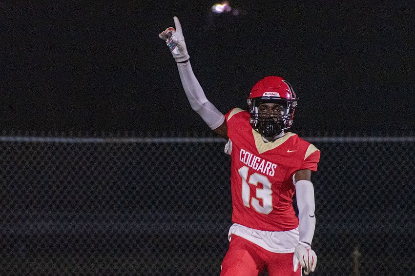 Cardinal Mooney sophomore Joshua Henderson calls for a shoulder bump from a teammate after a touchdown catch.
