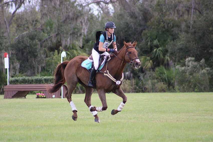 Victoria Sudkamp and Woodstock Rio glide above the ground at the TerraNova Equestrian Center on Saturday.