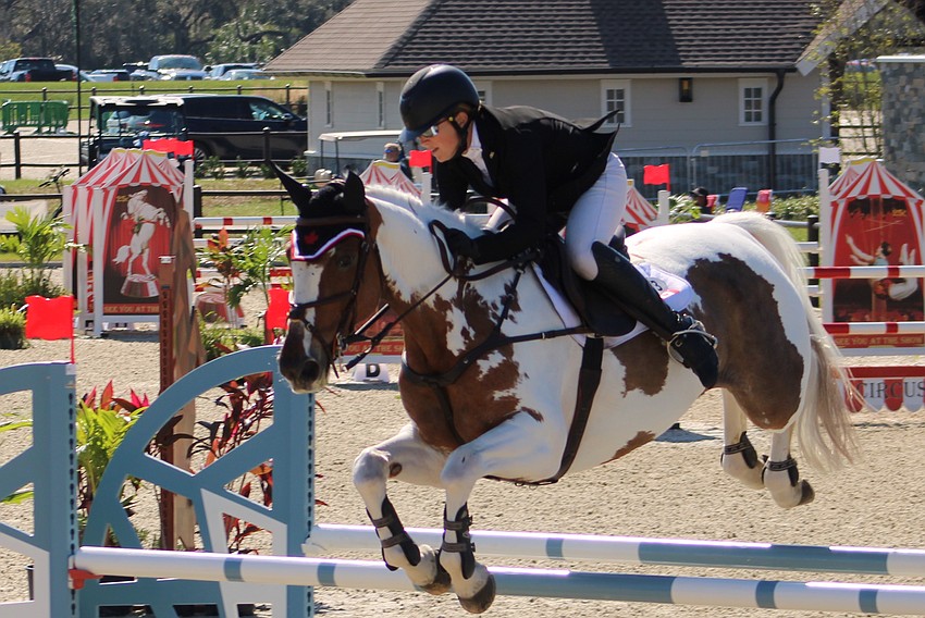 Jessica Phoenix of Canada easily clears a jump during the show jumping competition of The Event at TerraNova Nov. 19 in Myakka City. She finished eighth.