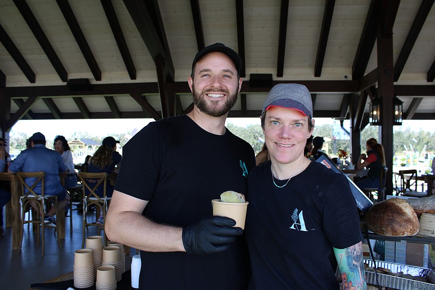 Jim Angus, the owner of Atria Cafe of Lakewood Ranch, and his baker, Tracy Cundiff, serve up French onion soup during the Empty Bowls fundraiser at The Event at TerraNova.