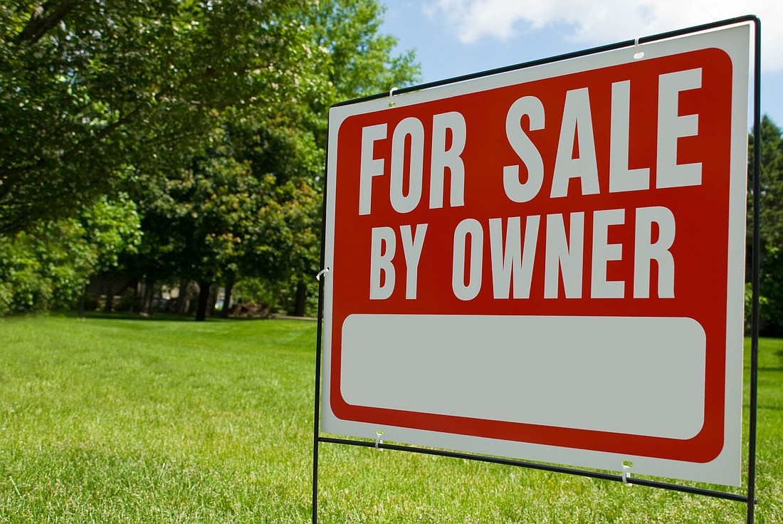 For Sale By Owner Sign. Image courtesy of Adobe Stock/paulvelgos