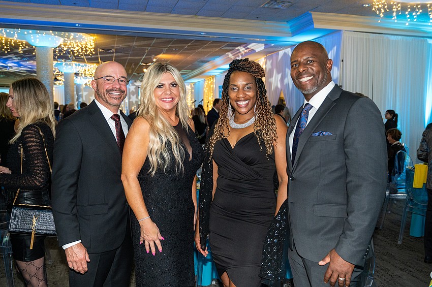 Chris and Amy Fehr with Shamekia and Joseph Dunn