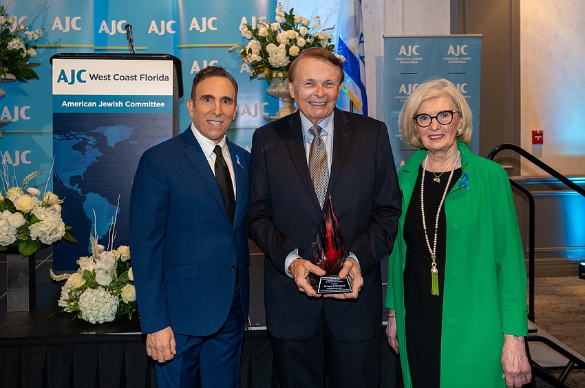 AJC Regional Director Brian Lipton, award recipient Larry Thompson and AJC Regional President Ann Virag