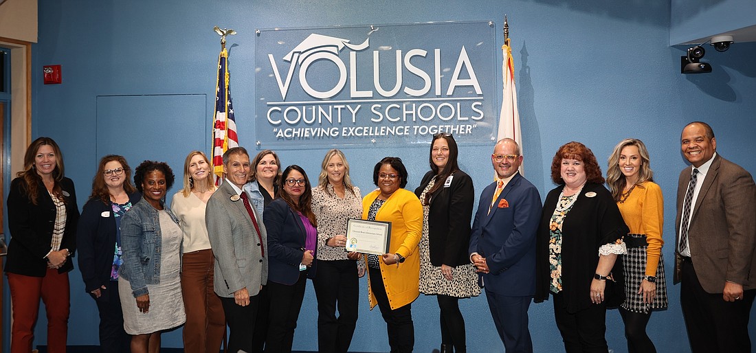 Volusia County School Board members, district staff, Ormond Beach Elementary School staff and OBE Principal Shannon Hay (fifth from right). Photo courtesy of Volusia County Schools' Facebook