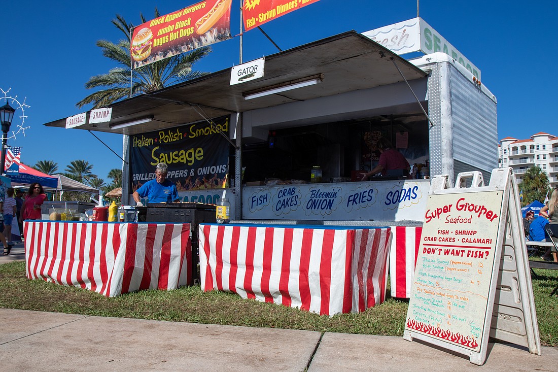 Super Grouper Seafood from Daytona Beach serves guests at Riverfest Seafood Festival. Photo by Suzanne McCarthy